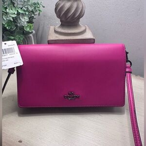 Coach Pink Crossbody Wallet On A Strap 8”x 5”x 1 1/4”.